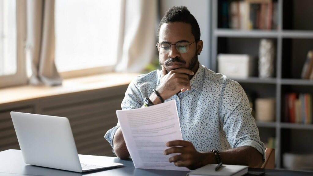 software developer reading freelancer contract before accepting the job